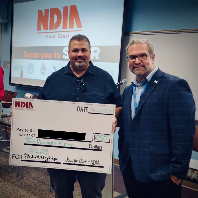 A SOAR Vocational Scholarship recipient poses with NDIA First Coast