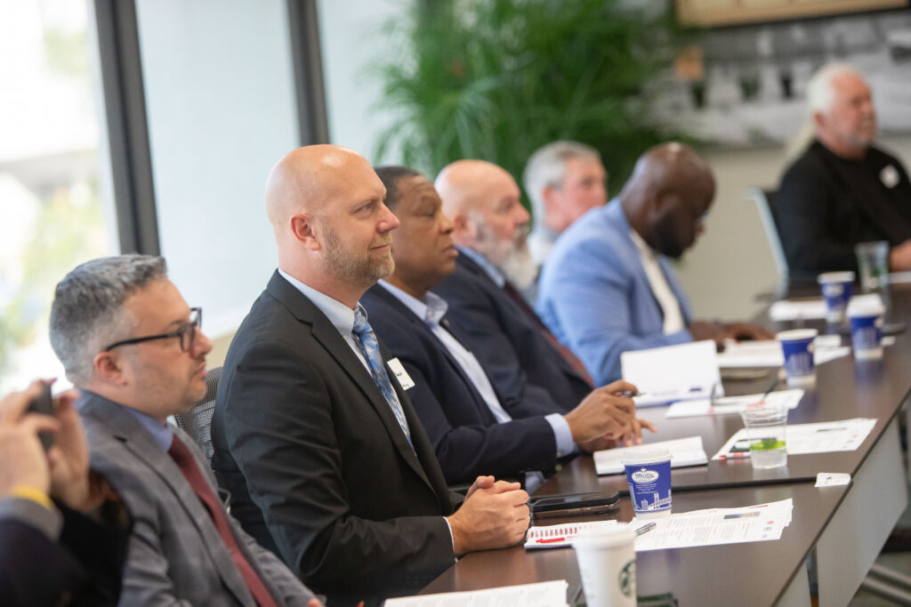 Attendees listen intently at the 2025 NDIA Defense Industry Roundtable.